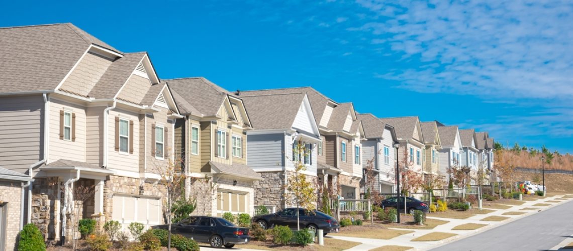 Row,Of,New,Development,Two,Story,Houses,With,Front,Garage